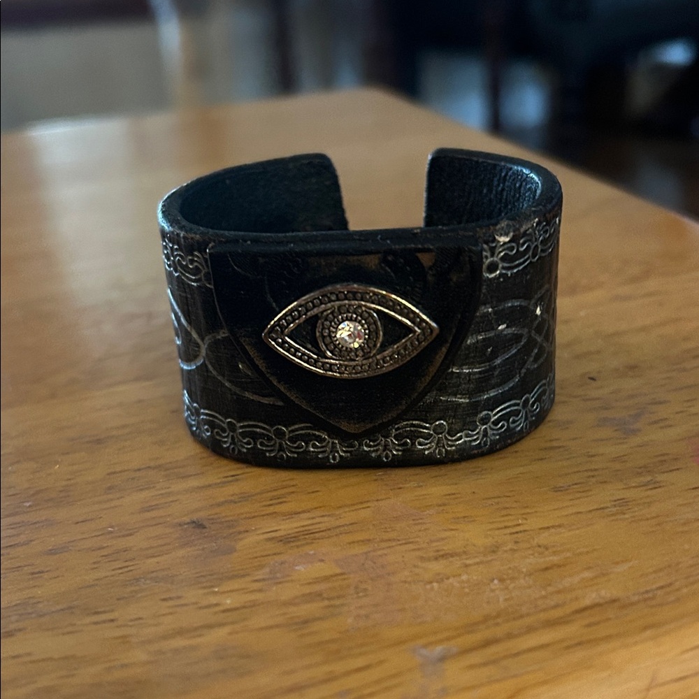 Elegant Black Leather Cuff Bracelet with Eye Design